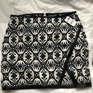 New Express mini skirt.  Black & white with black leather piping. Back zip.